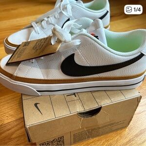 Nike White Sneakers with Black Swoosh and Tan Accents